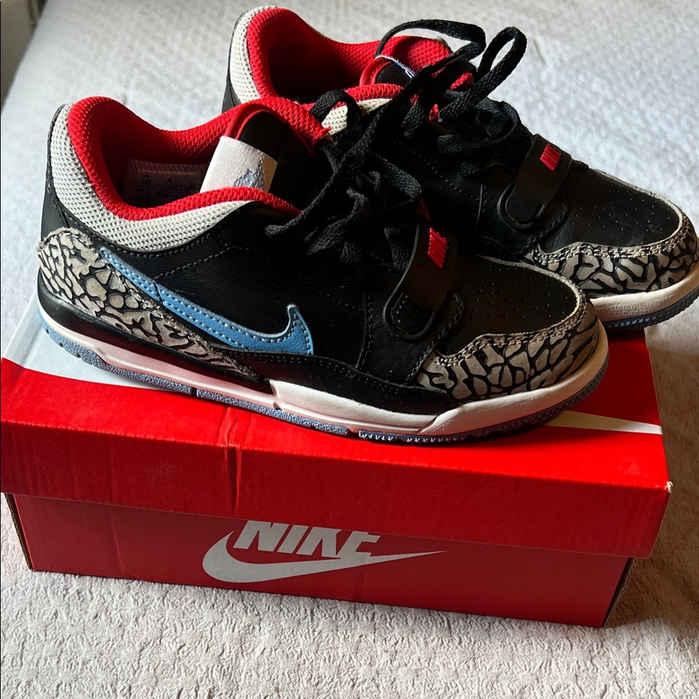 Nike Kids Black and Red Sneakers with Blue Swoosh
